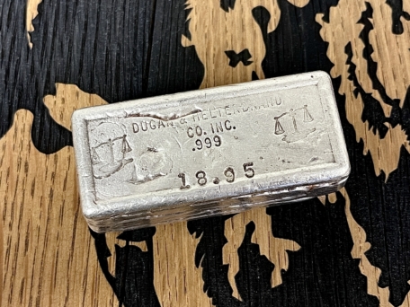 Dugan & Helterbrand 18.95 vintage silver bar Front