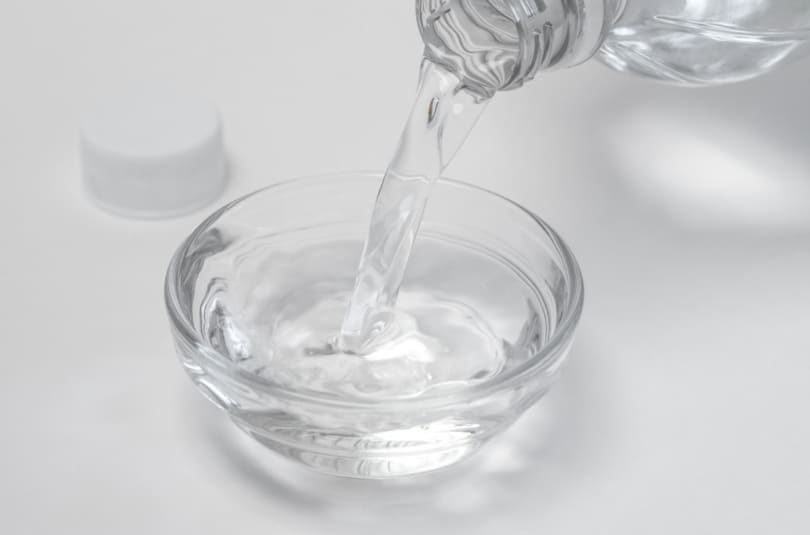 Pouring White Distilled Vinegar in a Bowl
